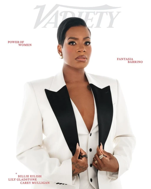 Close-up of Fantasia Barrino on Variety cover, wearing a white suit with a black lapel, posing indoors with a bright, neutral backdrop.