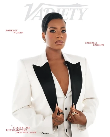 Close-up of Fantasia Barrino on Variety cover, wearing a white suit with a black lapel, posing indoors with a bright, neutral backdrop.