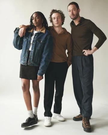 Three actors posing against a plain background, captured in a portrait by photographer Victoria Stevens.