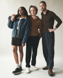Three actors posing against a plain background, captured in a portrait by photographer Victoria Stevens.