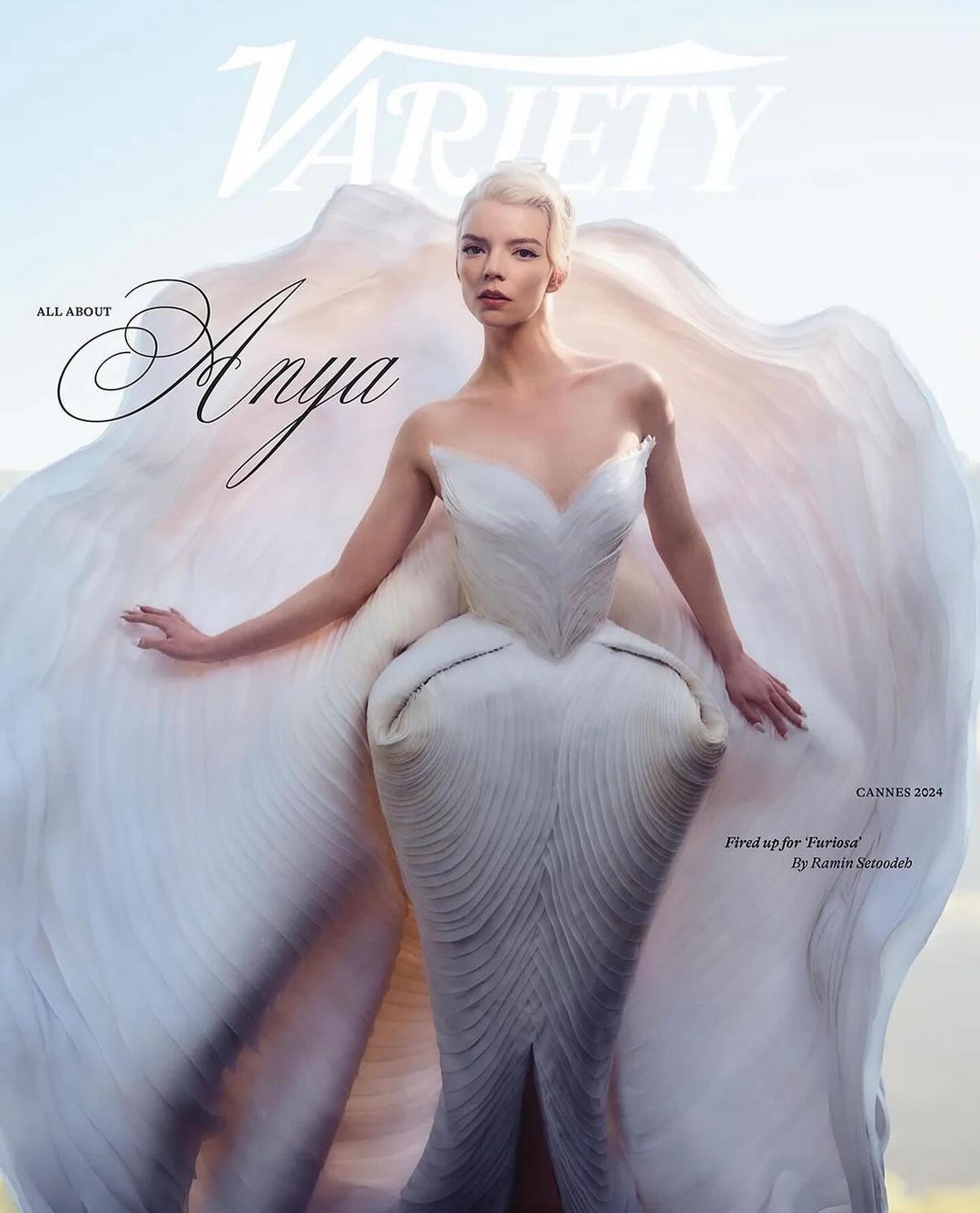 Anya Taylor-Joy on the cover of Variety magazine, posing in a white couture dress with dramatic ruffles in an outdoor setting.
