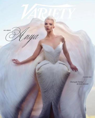 Anya Taylor-Joy on the cover of Variety magazine, posing in a white couture dress with dramatic ruffles in an outdoor setting.