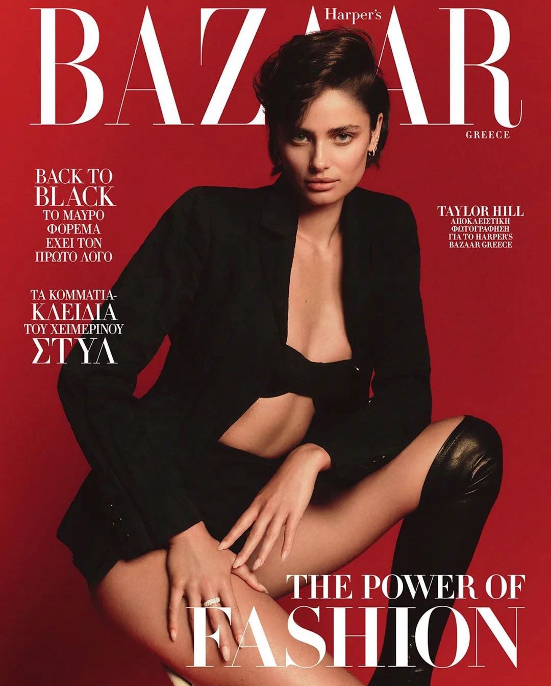 Harper's Bazaar Greece cover featuring model Taylor Hill in black jacket and thigh-high boots against a red backdrop.