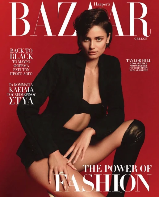Harper's Bazaar Greece cover featuring model Taylor Hill in black jacket and thigh-high boots against a red backdrop.