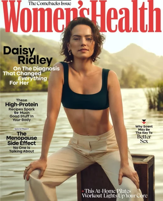 Daisy Ridley poses on a wooden crate wearing a sports bra and pants for Women's Health magazine cover with mountains in the background.