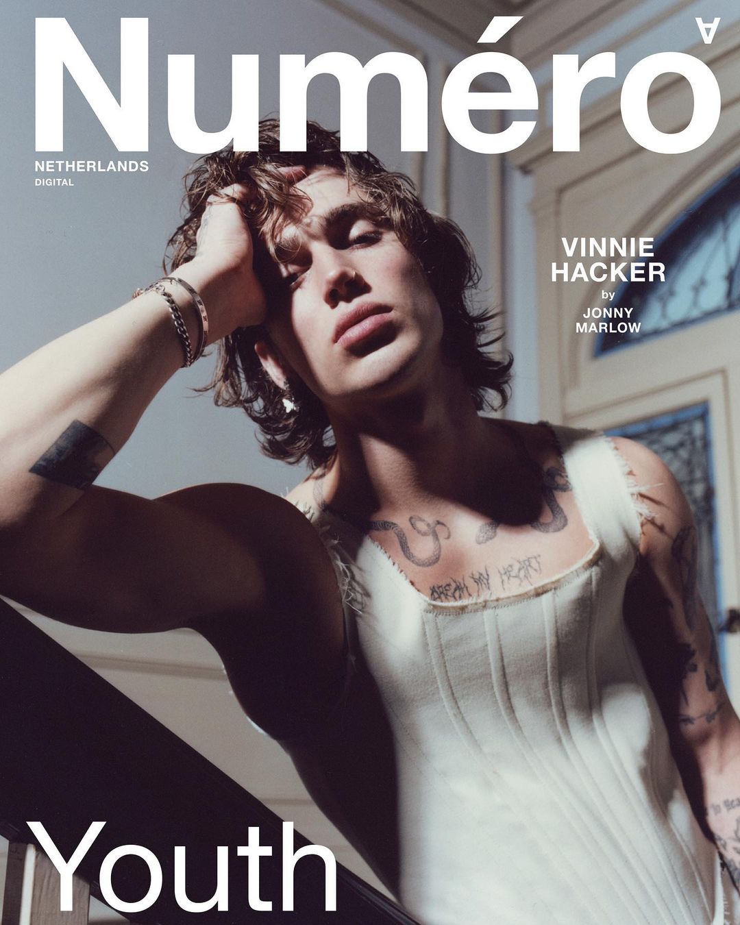 Magazine cover featuring a shirtless adult male model, Vinnie Hacker, with tattoos, shot at eye-level in a casual pose against a neutral background.