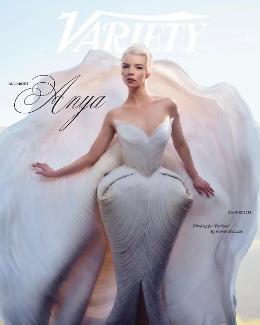 Anya Taylor-Joy on Variety Magazine cover, wearing a white sculptural gown with shell-like details, standing outdoors in sunlight.