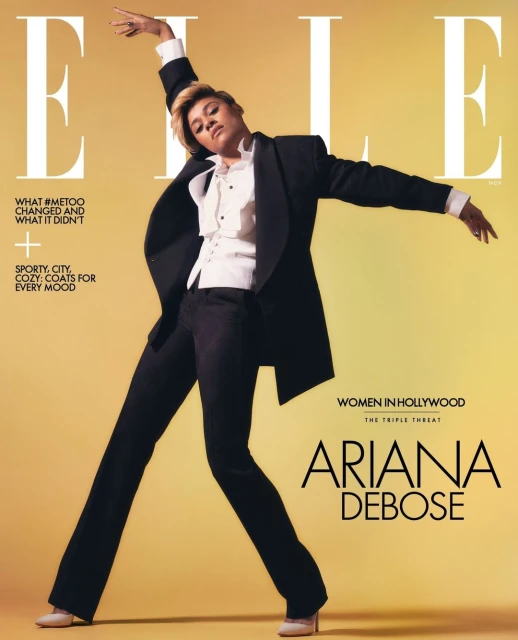 Elle Magazine cover featuring Ariana DeBose in a black suit and white blouse against a gradient yellow background. Text includes magazine title and taglines.