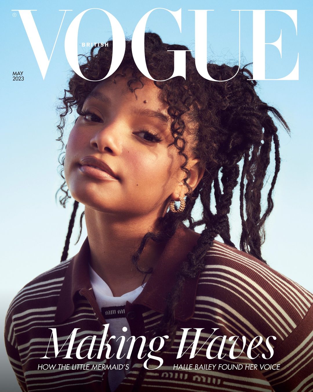 British Vogue magazine cover featuring Halle Bailey, May 2023 issue. She is wearing a striped top and has long dark hair.