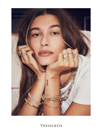 Hailey Bieber wearing layered gold and diamond jewelry by photographer Sharif Hamza