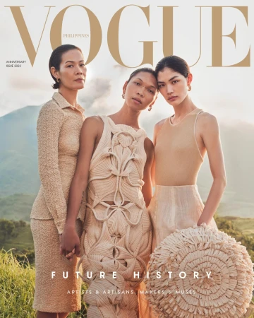 Vogue Philippines magazine cover featuring three women in neutral-toned, textured garments against a backdrop of mountains and sky.
