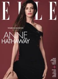 Anne Hathaway wearing a black one-shoulder dress against a dark red studio background for an Elle magazine cover.