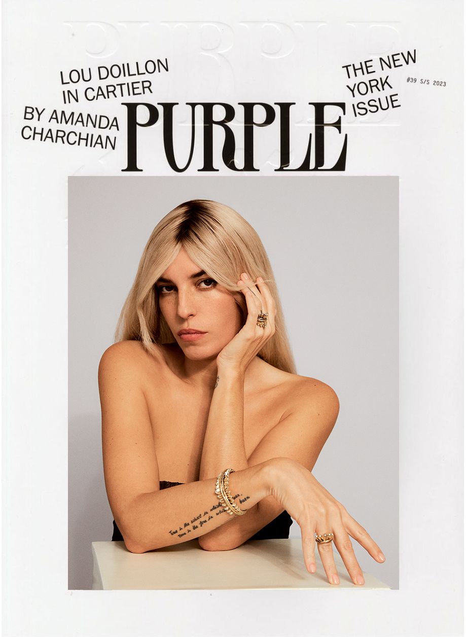 Magazine cover featuring a blonde woman with jewelry, including rings and a bracelet, with the masthead 'PURPLE' and various cover lines.