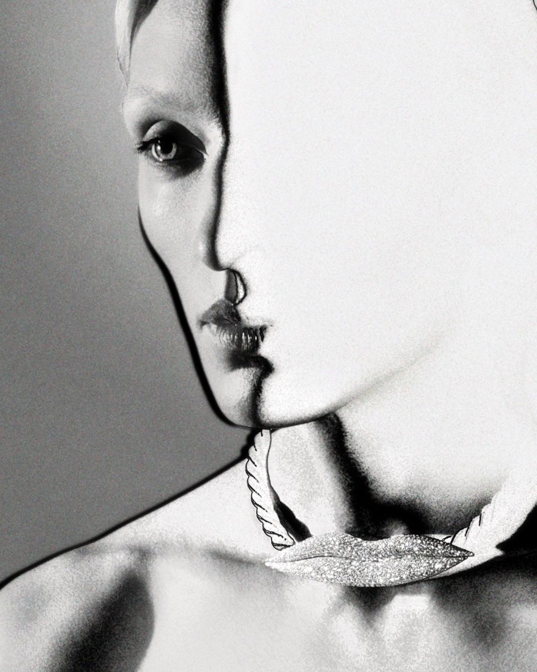 Close-up monochrome portrait of a model wearing a textured choker necklace by photographer Amanda Charchian.