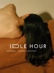 A person with long dark hair lying face down on a brown leather surface, shot by photographer Amanda Charchian.