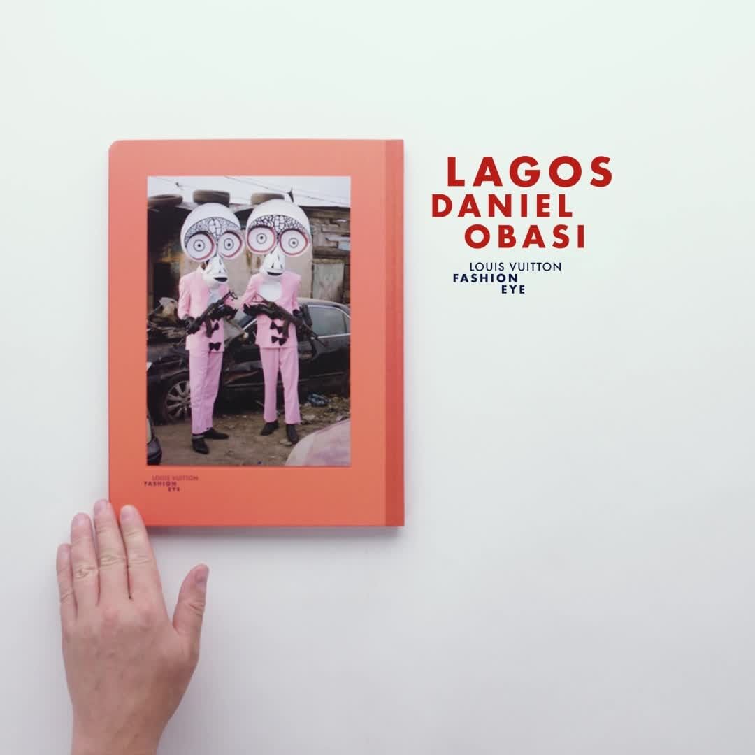 Book cover of "Lagos Daniel Obasi" shows two people in costume with masks and pink suits, standing outside, next to damaged vehicles.
