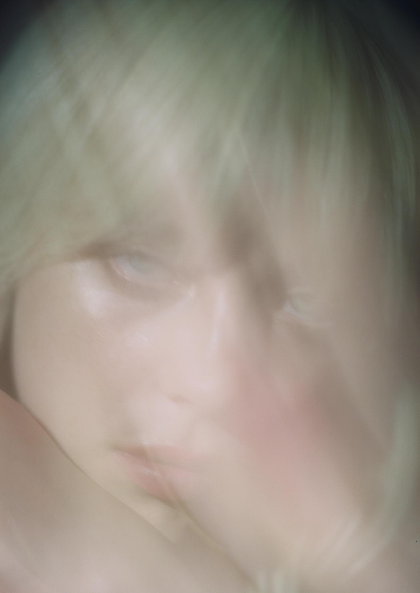 Close-up portrait of a blonde person with motion blur, shot by photographer Mason Poole in Los Angeles.