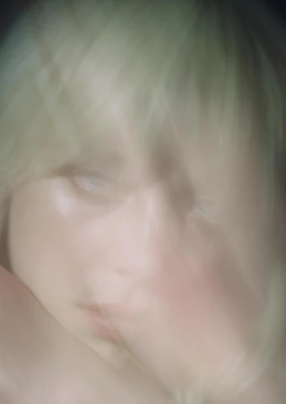 Close-up portrait of a blonde person with motion blur, shot by photographer Mason Poole in Los Angeles.