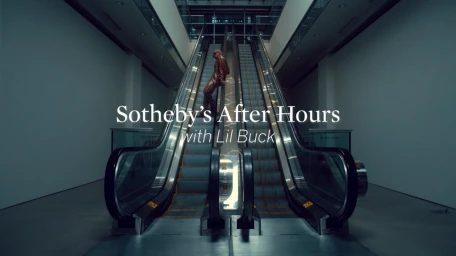 A dancer on ascending escalators in a modern building interior with overlaid title text.