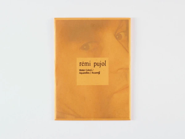 Art book cover featuring the words 'rémi pujol,' 'Water Colors,' and 'Aquarelles,' with a faded image of a face on a yellow background.
