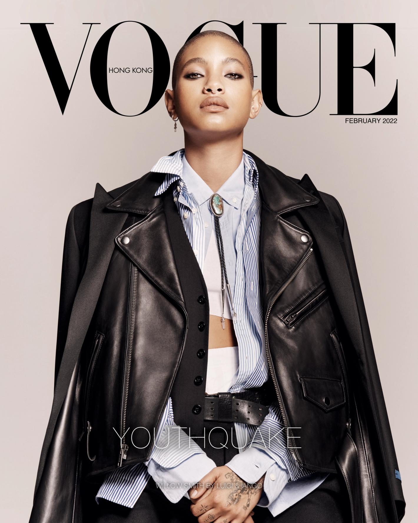 Vogue Hong Kong cover featuring a person with dark hair wearing a black leather jacket, striped shirt, and black vest against a neutral background.