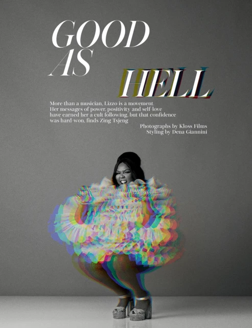 Singer Lizzo poses in a colorful, ruffled dress and platform heels in a studio shot against a gray background with text overlay.