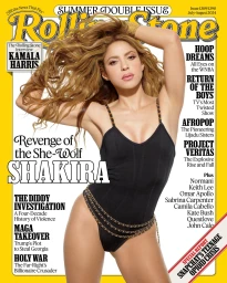 Shakira posing in a black swimsuit with chain straps for a Rolling Stone magazine cover styled by Dena Giannini.