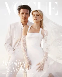 Brooklyn Beckham and Nicola Peltz on a magazine cover in white wedding attire against a soft sunset sky