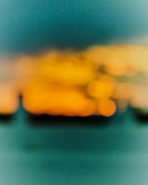 Abstract background featuring out-of-focus yellow and green hues, creating a blurred, dreamlike aesthetic perfect for backgrounds.