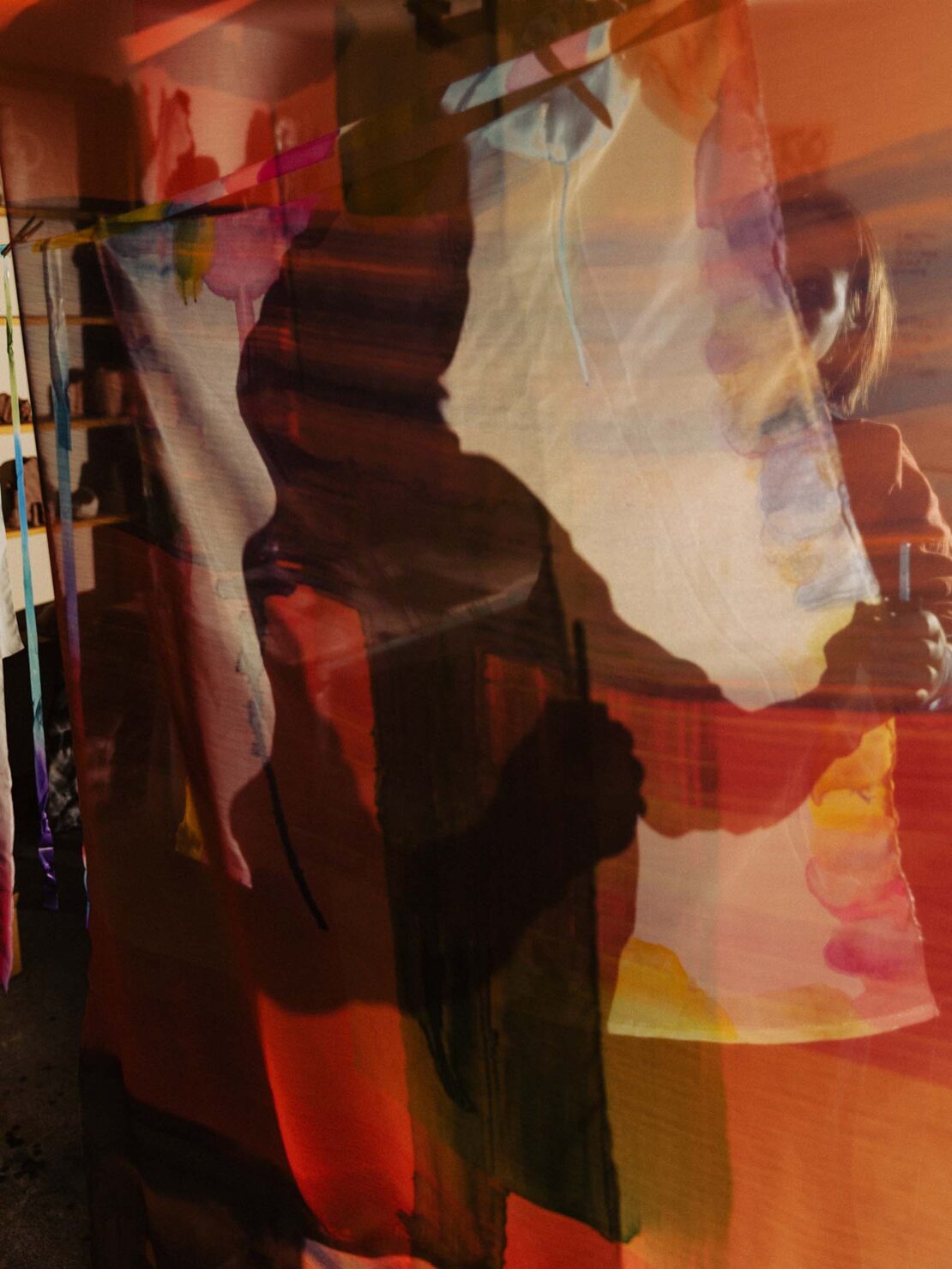 Abstract double exposure art featuring a woman holding a brush in an art studio, creating a surreal and artistic visual effect.