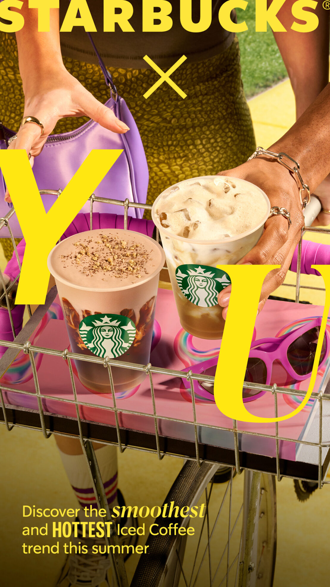 Starbucks summer drink advertisement featuring two drinks on a bike rack with a yellow filter, showing the drinks and bicycle.