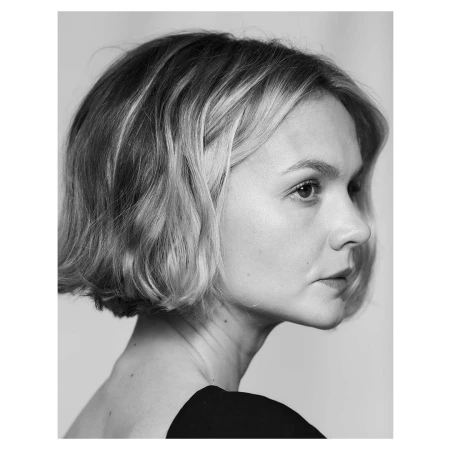 Portrait of a woman with short wavy hair in profile, photographed by Lauren Dukoff