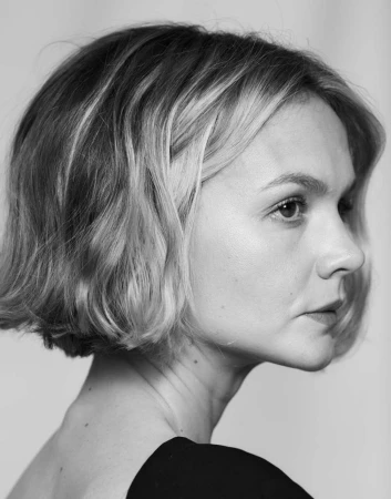 Monochrome portrait of a woman with short wavy hair in profile, photographed by Lauren Dukoff