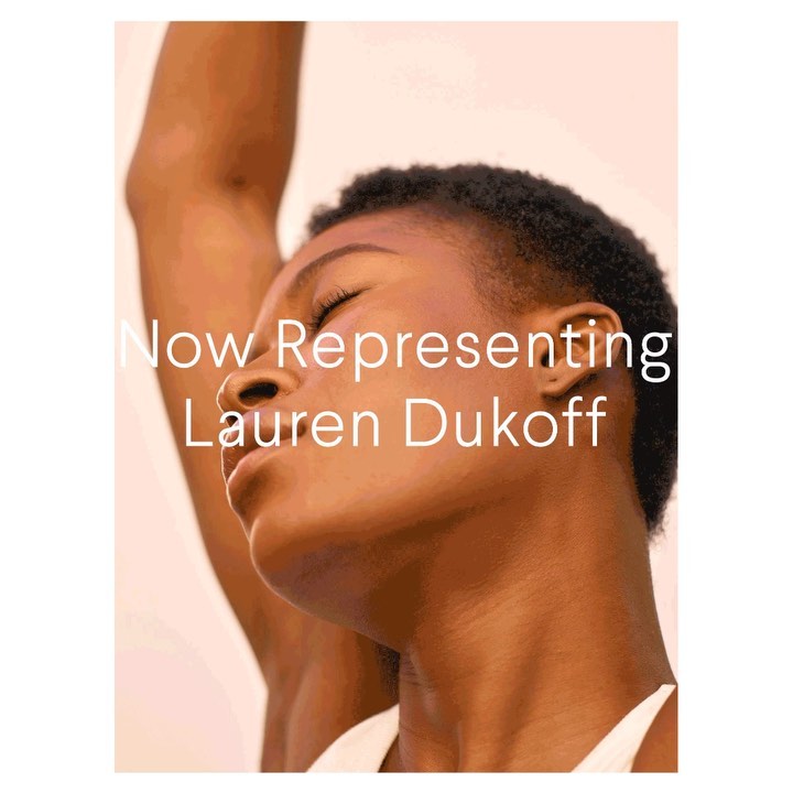 Close-up portrait of a dark-skinned adult female with short hair against a light background. Arm is raised, eyes are closed. Text overlay.