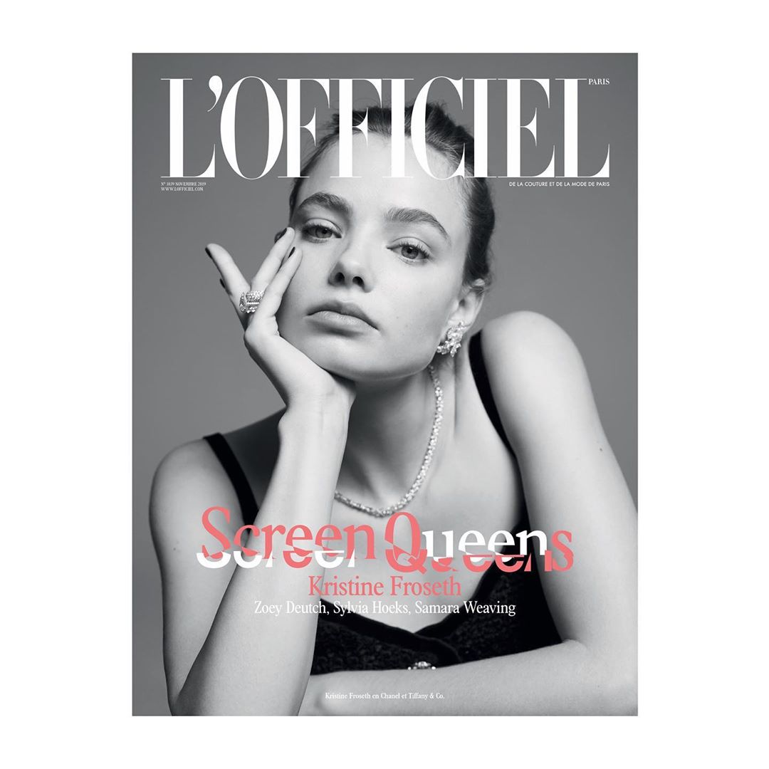 Monochrome magazine cover portrait of Kristine Froseth wearing a dark tank top and diamond jewelry against a plain grey background