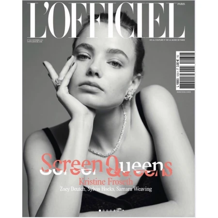 Magazine cover portrait by Lauren Dukoff featuring a woman with her hand resting on her cheek, wearing a diamond necklace and earrings.
