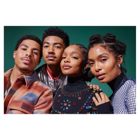 Group portrait of four young adults with diverse hairstyles and jewel-toned clothing, set against a solid green backdrop.