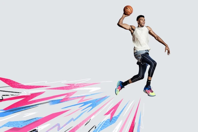 Adult male basketball player in mid-air with ball, sleeveless top, athletic leggings, light background with artistic graphics and design.