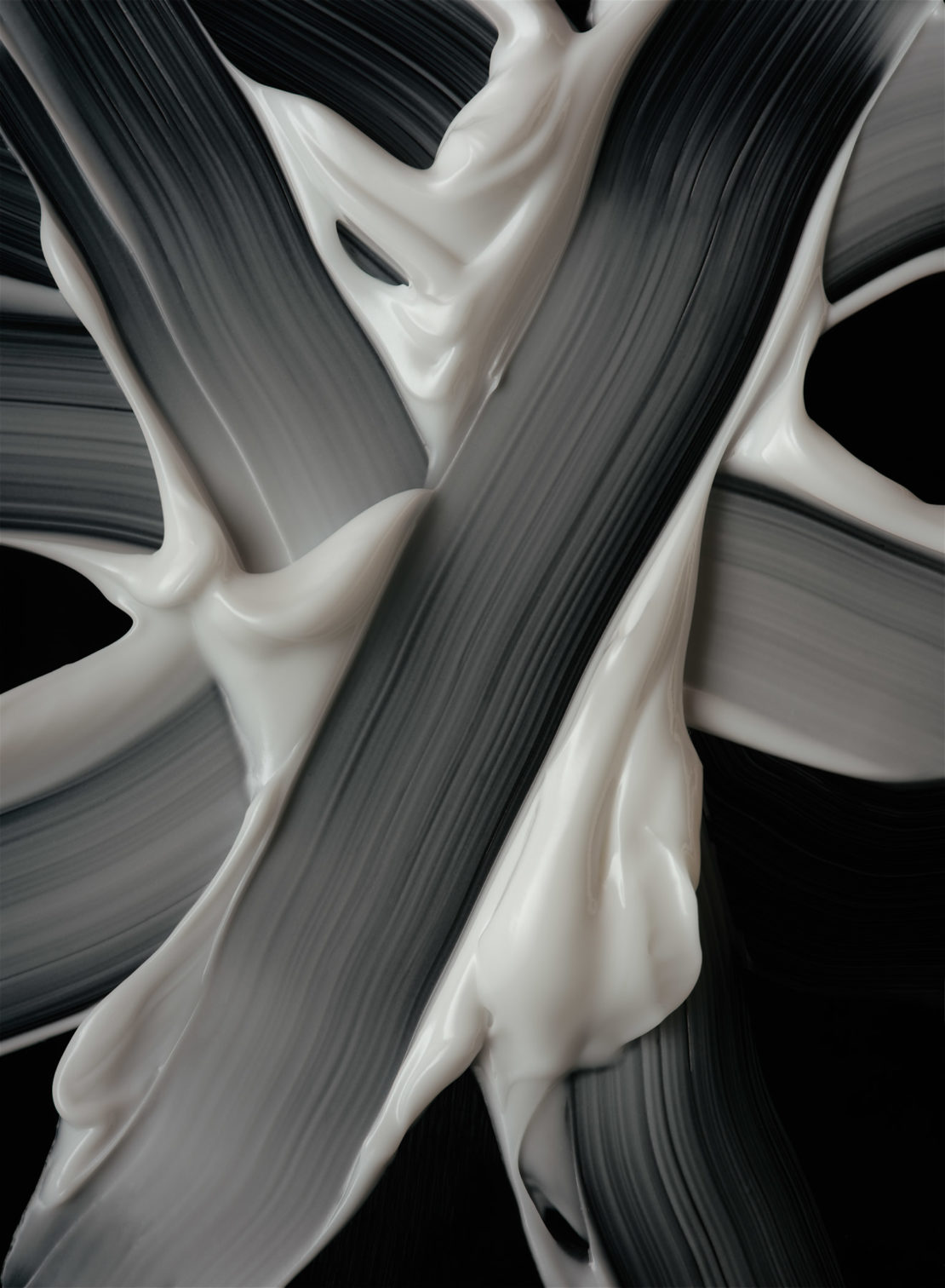 Swirls of thick, light-beige cream texture against a black backdrop, abstract beauty concept, skincare, or cosmetic product shot.