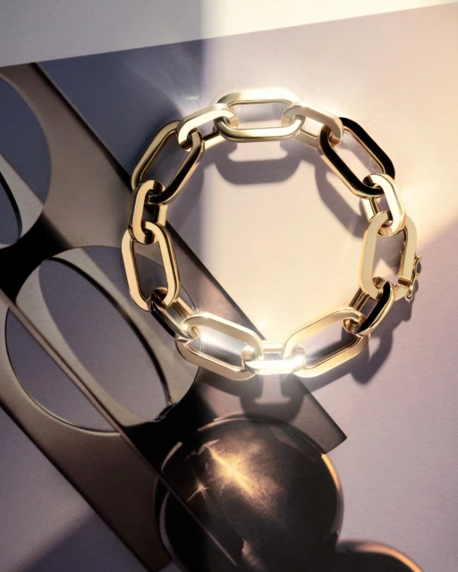 Close-up studio shot of a gold chain-link bracelet with warm, diffused lighting and a modern grey and white background.