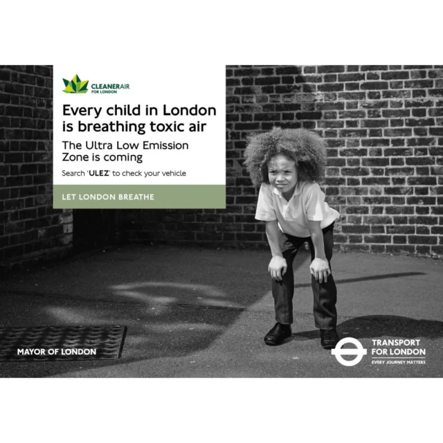 Child with hands on knees stands in front of a brick wall, part of an ad campaign with text about toxic air and London's ULEZ.