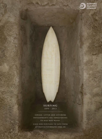 Surfboard in a grave as a symbol of the decline of surfing due to water pollution, in a promotional image for Surfers Against Sewage.