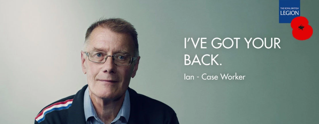 Close-up portrait of a mature man with glasses wearing a collared shirt and jacket, set against a soft green background with text.