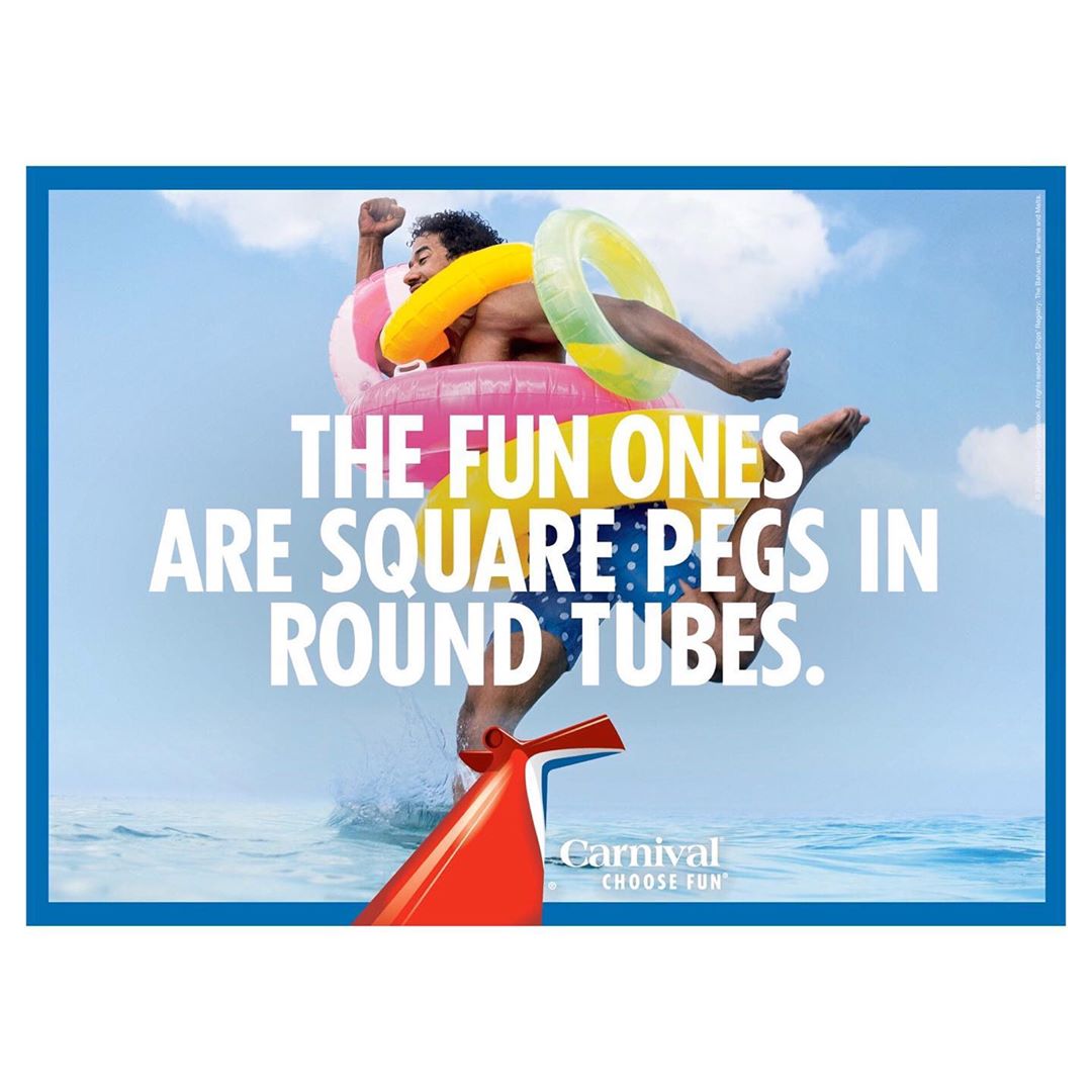 Man jumping in the air with inflatable rings against a backdrop of sky and water, Carnival Cruise Line advertisement.