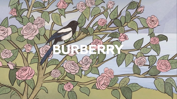 Illustration of a bird perched on a branch with pink roses, set against a soft pastel landscape and the Burberry logo in white text.