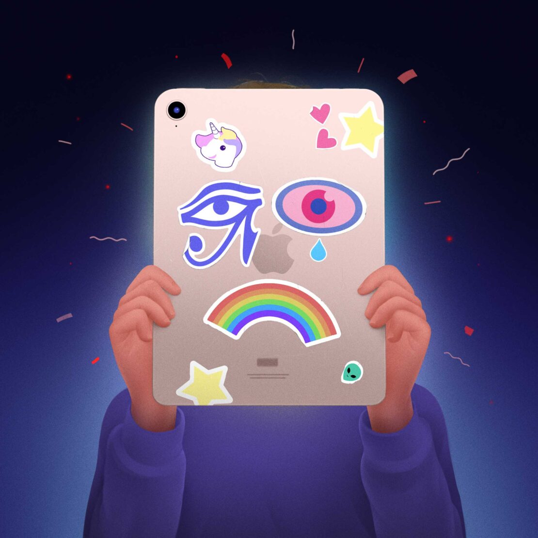 Illustration of hands holding up an iPad decorated with stickers of a unicorn, rainbow, stars, and an eye against a dark blue background.