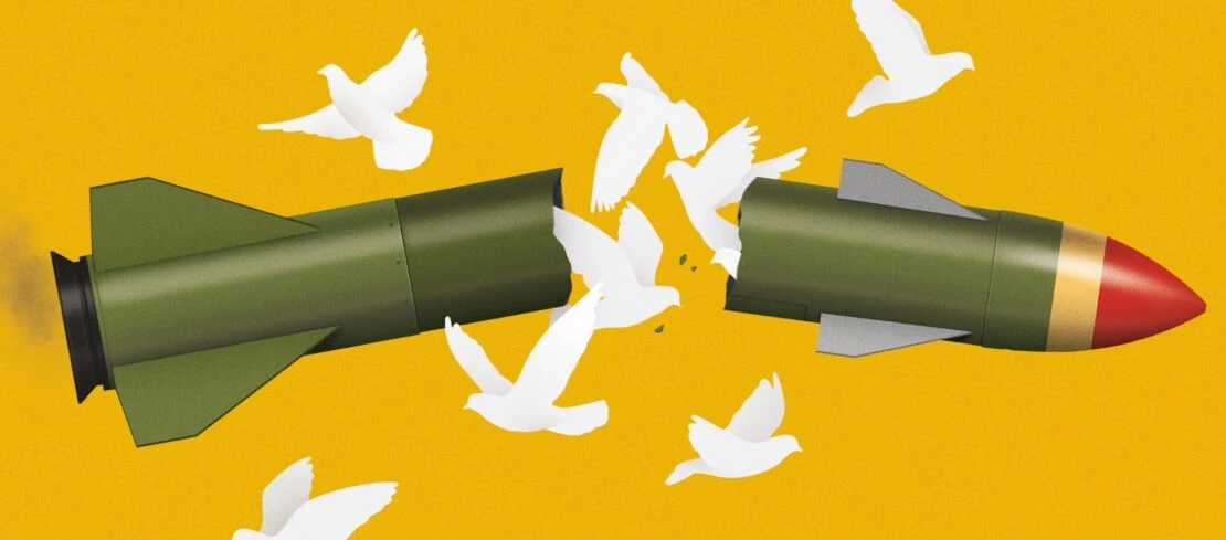Artwork shows a broken missile with white doves emerging, set against a bright yellow background, symbolizing peace and disarmament.