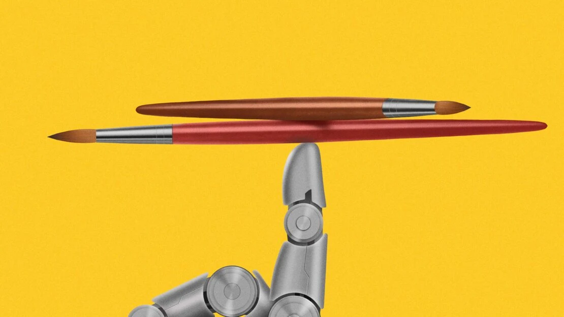 Two paintbrushes balancing on a robot hand against a solid yellow background, showcasing precision and modern art techniques.