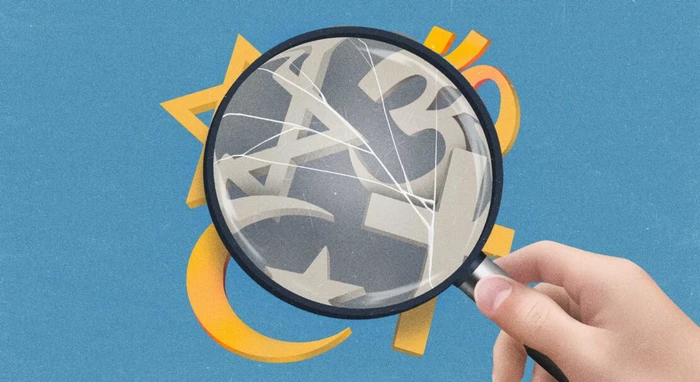 Hand holding a cracked magnifying glass over an illustrated blue background with yellow abstract shapes