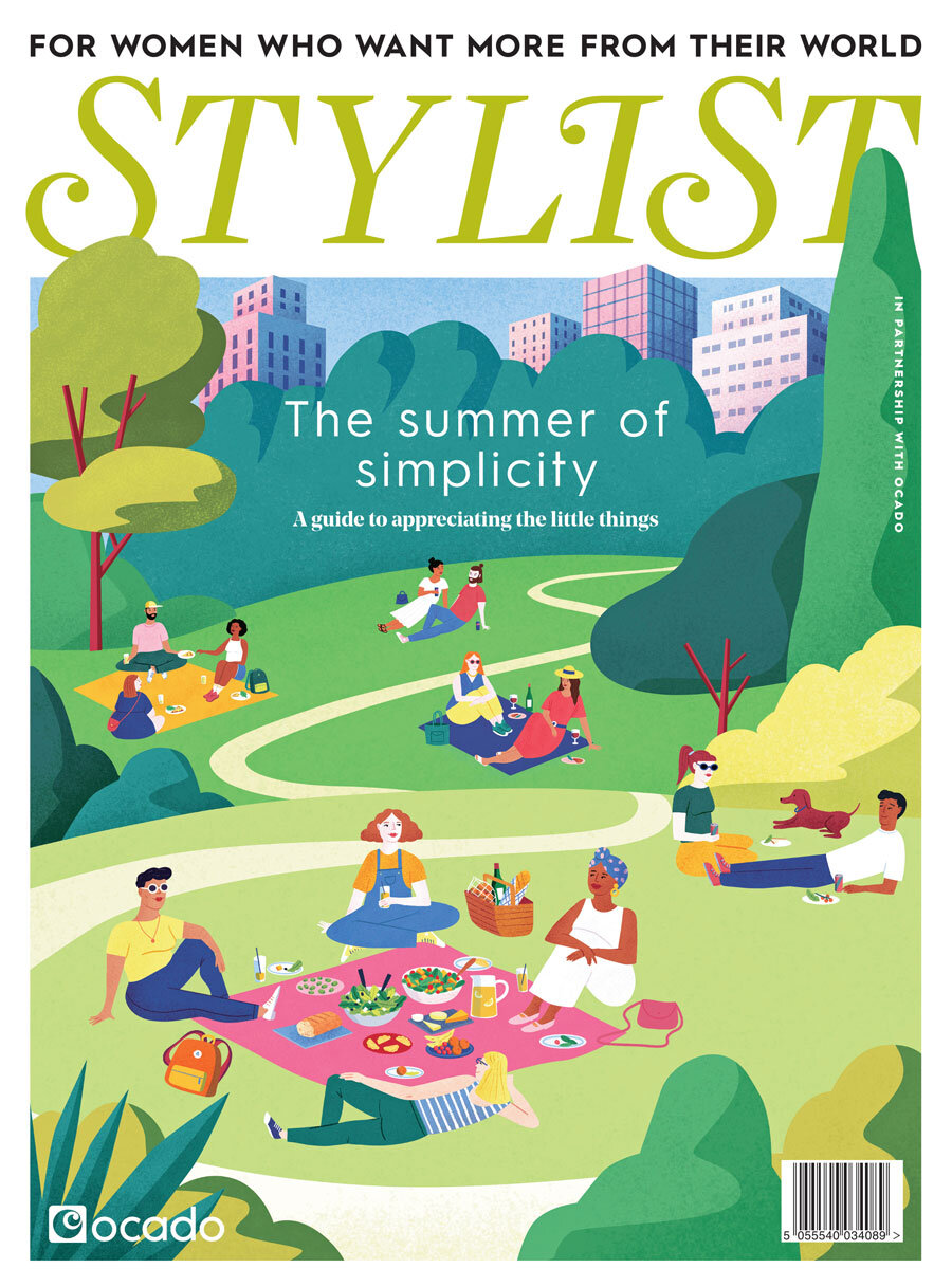 Stylist magazine cover illustration: people picnicking in a city park with green trees and modern buildings. Cover text reads: The summer of simplicity.